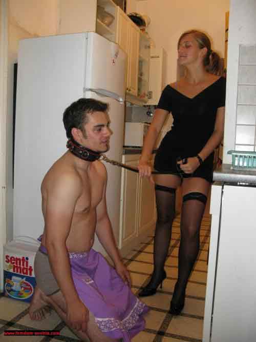 a mistress with a leash on a slave