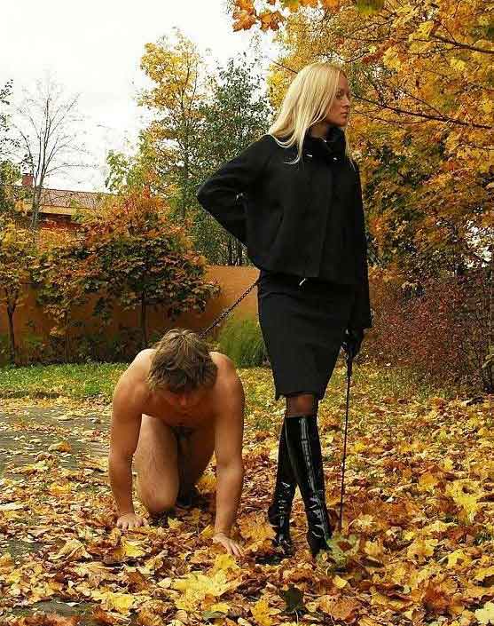 a mistress walks in the park with slave