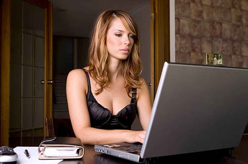 mistress reading on a laptop