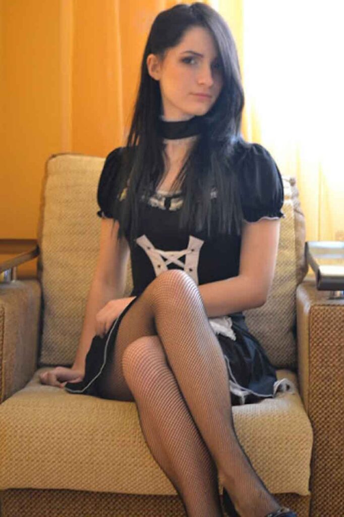 a mistress sits on a chair