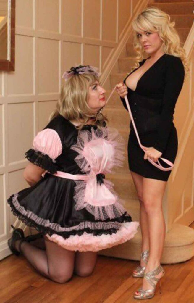 a sissy maid in front of female