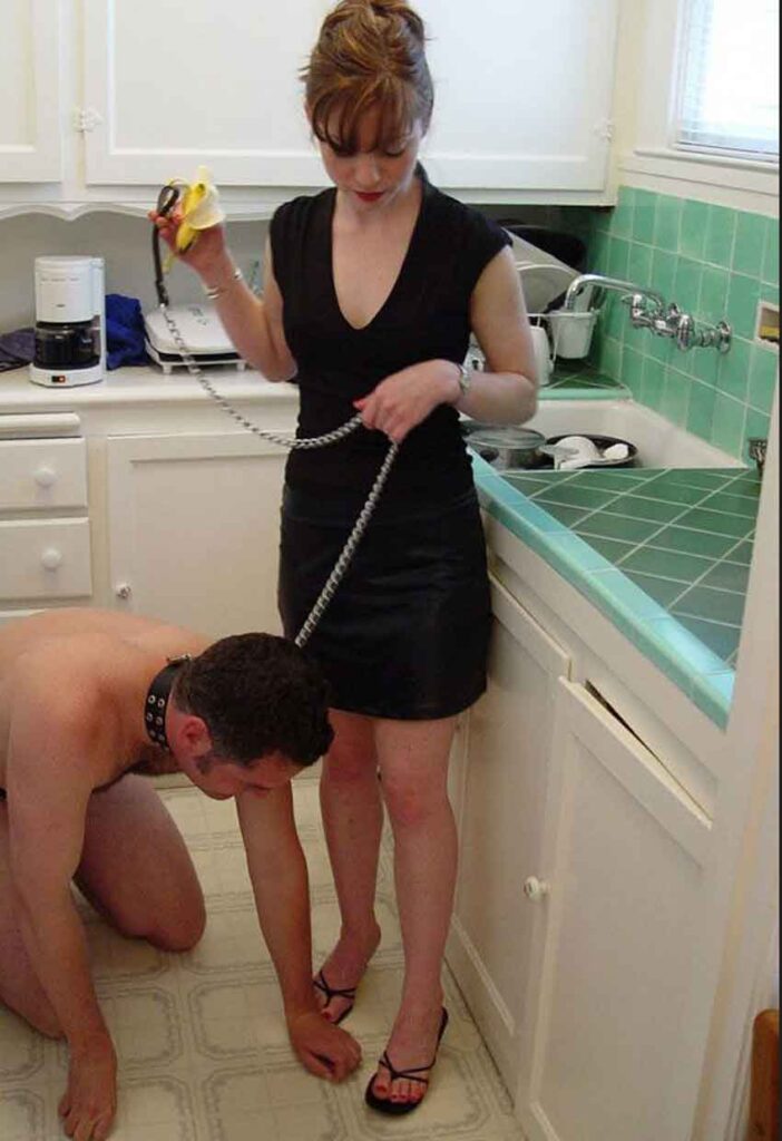a female dominant collars her man
