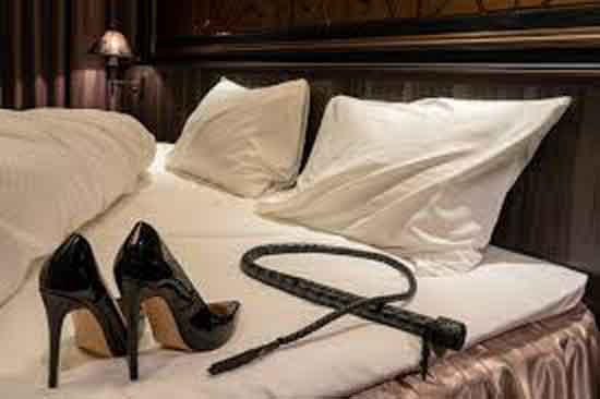 high heels and whip on bed