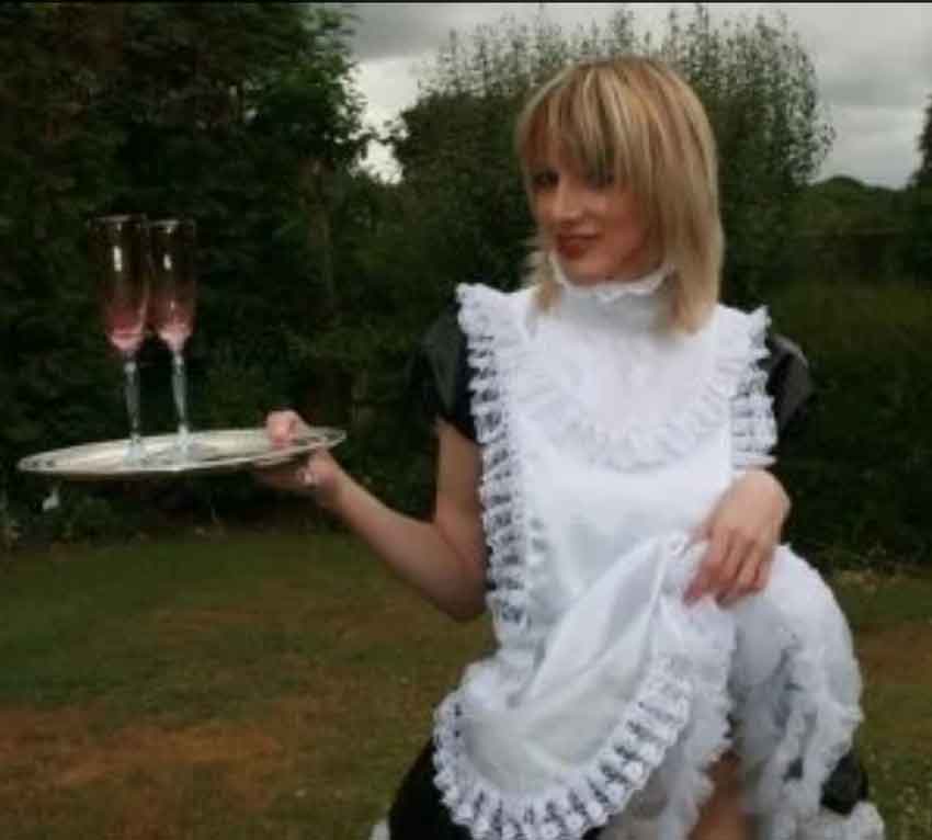 a sissy housemaid serving champagne
