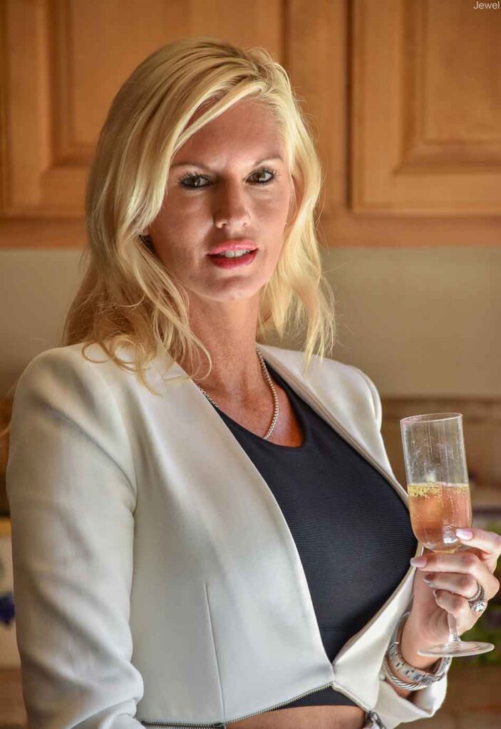 a well dressed woman with champagne