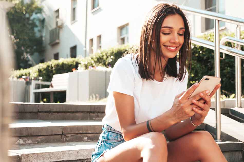 a female dominant texts with a smartphone