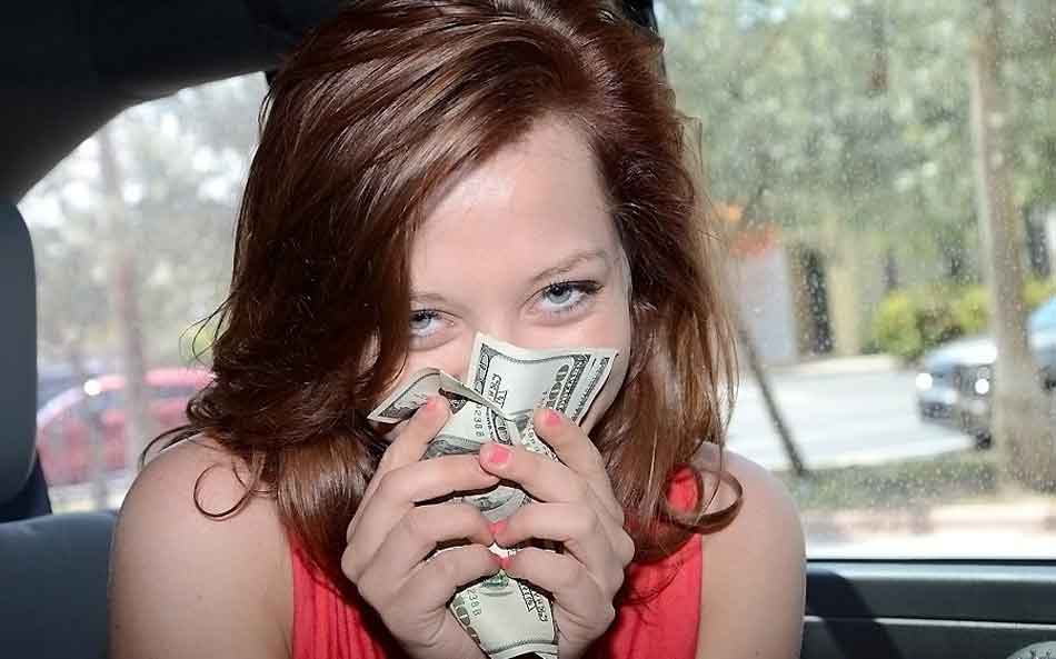 a financial dominant brunette mistress receives cash and smiles