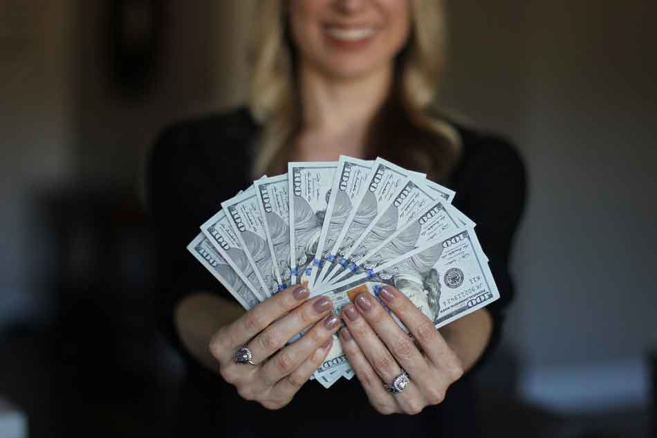 a financial dominant mistress fanning cash